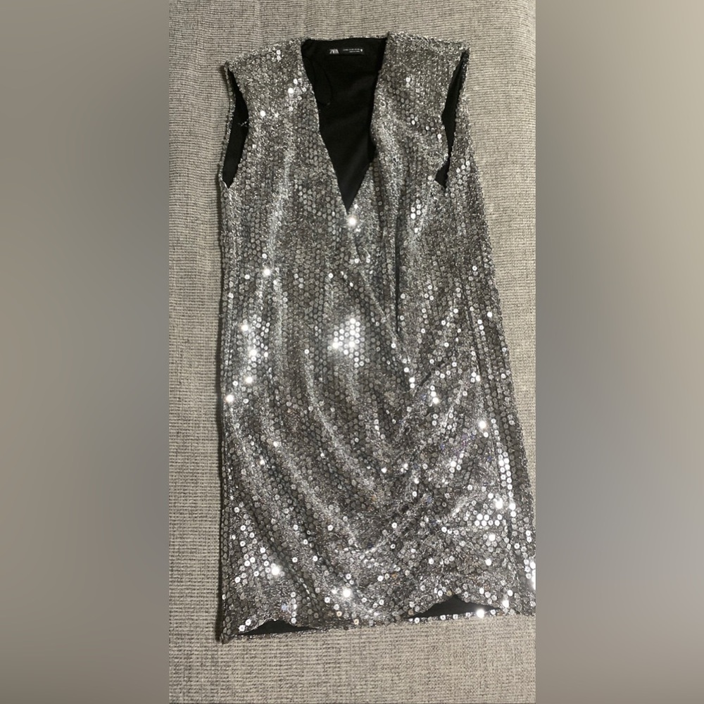 Silver sequins vest like dress.